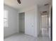 Clean bedroom with light-tone floors, closet and an exterior view at 1816 Braddock Ave, North Port, FL 34288