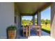 Covered patio with outdoor dining set perfect for enjoying outdoor living and entertaining at 1816 Braddock Ave, North Port, FL 34288