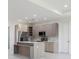 Bright kitchen featuring stainless steel appliances, a center island, and modern cabinetry at 1816 Braddock Ave, North Port, FL 34288