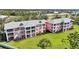 A beautiful aerial view of the condos with well-manicured landscaping at 2061 Willow Hammock Cir # 303, Punta Gorda, FL 33983
