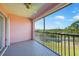 A screened balcony overlooks green space and mature trees, providing a serene outdoor retreat at 2061 Willow Hammock Cir # 303, Punta Gorda, FL 33983