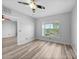 Relaxing bedroom with neutral colors, wood-look flooring, and natural light at 2061 Willow Hammock Cir # 303, Punta Gorda, FL 33983