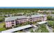 Three-story condominiums offer covered parking and balconies in a lush, tropical setting at 2061 Willow Hammock Cir # 303, Punta Gorda, FL 33983