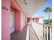 Exterior hallway shot of the building with unit 303 on the left at 2061 Willow Hammock Cir # 303, Punta Gorda, FL 33983