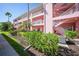 A well-kept exterior view of the condo building and landscaping at 2061 Willow Hammock Cir # 303, Punta Gorda, FL 33983