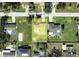 Aerial view of the property within the neighborhood, offering insights into the surrounding community and lot size at 21035 Exmore Ave, Port Charlotte, FL 33952