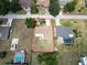 Aerial view of the property showing the boundaries, roof, driveway, and surrounding neighborhood at 21035 Exmore Ave, Port Charlotte, FL 33952