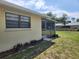Exterior view showcasing side of home and screen patio at 21035 Exmore Ave, Port Charlotte, FL 33952