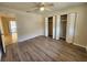 Bedroom with a ceiling fan and large closets, next to the patio at 21035 Exmore Ave, Port Charlotte, FL 33952