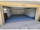 Clean garage space with newly painted floor, presenting a versatile area for parking, storage, or hobbies at 21035 Exmore Ave, Port Charlotte, FL 33952