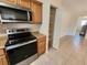 The stylish kitchen offers stainless steel appliances and a pantry at 21035 Exmore Ave, Port Charlotte, FL 33952