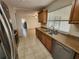 Updated kitchen featuring granite counters, a stainless steel dishwasher, and a window at 21035 Exmore Ave, Port Charlotte, FL 33952