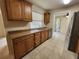 The kitchen is finished with cabinets, granite counters, and stainless steel appliances at 21035 Exmore Ave, Port Charlotte, FL 33952