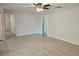 Open living space with tiled flooring and neutral color scheme throughout at 21035 Exmore Ave, Port Charlotte, FL 33952