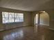 Living room featuring tile floors, neutral paint, and a window with sheer curtains at 21035 Exmore Ave, Port Charlotte, FL 33952