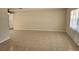 Spacious living room featuring tile flooring, neutral paint, and natural lighting at 21035 Exmore Ave, Port Charlotte, FL 33952