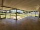 Enjoy this screened patio area with tile floor and views of the yard at 21035 Exmore Ave, Port Charlotte, FL 33952