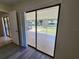 This patio features a large door, and a view of the fenced yard at 21035 Exmore Ave, Port Charlotte, FL 33952