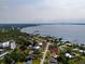 An aerial view of a charming coastal neighborhood featuring waterfront homes and private docks at 23491 Harper Ave, Punta Gorda, FL 33980