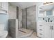 Tiled shower featuring gray tile at 23491 Harper Ave, Punta Gorda, FL 33980