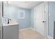 Bright bathroom with modern vanity and tile flooring at 23491 Harper Ave, Punta Gorda, FL 33980