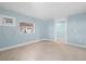 Light blue bedroom with tile floors at 23491 Harper Ave, Punta Gorda, FL 33980