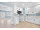 Bright kitchen featuring white cabinets and stainless steel microwave at 23491 Harper Ave, Punta Gorda, FL 33980