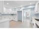 Renovated kitchen featuring white cabinetry, and stainless steel appliances at 23491 Harper Ave, Punta Gorda, FL 33980