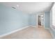 Light blue living room with tile floors at 23491 Harper Ave, Punta Gorda, FL 33980