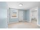 Neutrally painted room with light tile floors and window, ready for customization at 23491 Harper Ave, Punta Gorda, FL 33980