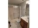 Cozy bathroom with shower-tub combo, wood vanity and tiled flooring at 25225 Rampart Blvd # 1801, Punta Gorda, FL 33983
