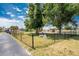 Enclosed dog park with entrance sign, grassy area, and mature shade trees for community residents at 25225 Rampart Blvd # 1801, Punta Gorda, FL 33983