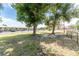 The community dog park features a grassy area and a bench under mature shade trees at 25225 Rampart Blvd # 1801, Punta Gorda, FL 33983