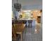 View of the bright eat-in kitchen with ample counter space, wood cabinets, and modern appliances at 25225 Rampart Blvd # 1801, Punta Gorda, FL 33983
