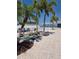 Enjoy the pool area, with palm trees, lounge chairs, and a fun mural on the building at 25225 Rampart Blvd # 1801, Punta Gorda, FL 33983