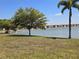 Beautiful water view with mature trees and manicured lawn at 25225 Rampart Blvd # 1801, Punta Gorda, FL 33983