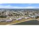 An aerial view showcases the community with a lake in the background at 26290 Rampart Blvd # D, Punta Gorda, FL 33983