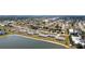 Aerial view features the complex and its proximity to a serene lake at 26290 Rampart Blvd # D, Punta Gorda, FL 33983
