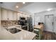 Well-equipped kitchen with ample counter space, stainless steel appliances, and a rolling island at 26290 Rampart Blvd # D, Punta Gorda, FL 33983