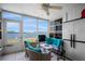 Bright sunroom with lake view, comfortable seating, and tiled flooring at 26290 Rampart Blvd # D, Punta Gorda, FL 33983