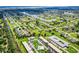 Aerial view showcasing the neighborhood layout and proximity to natural waterways at 26485 Rampart Blvd # C1, Punta Gorda, FL 33983