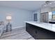Bright kitchen featuring stainless steel appliances, white countertops, and modern lighting at 26485 Rampart Blvd # C1, Punta Gorda, FL 33983