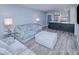 Spacious living room with comfortable seating, modern decor, and an open floor plan at 26485 Rampart Blvd # C1, Punta Gorda, FL 33983