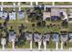 Aerial view of neighborhood showing the roof lines of the houses and their landscaping from directly overhead at 277 Long Meadow Ln, Rotonda West, FL 33947