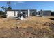 Image of new home construction showing the block walls being erected on a dirt lot under a clear blue sky at 277 Long Meadow Ln, Rotonda West, FL 33947