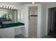 Bathroom featuring a walk-in shower, a vanity area and a large mirror at 29211 Picador St, Punta Gorda, FL 33982