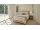 Bright bedroom featuring a glass sliding door to the backyard and large windows. (Virtually Staged) at 29211 Picador St, Punta Gorda, FL 33982