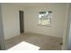 Empty bedroom features a window offering natural light and an adjacent closet at 29211 Picador St, Punta Gorda, FL 33982