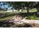 Stone fire pit in a backyard setting, perfect for outdoor gatherings and relaxation at 29211 Picador St, Punta Gorda, FL 33982
