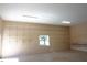 Garage interior featuring wall-to-wall shelving, a window for natural light, and potential for storage at 29211 Picador St, Punta Gorda, FL 33982